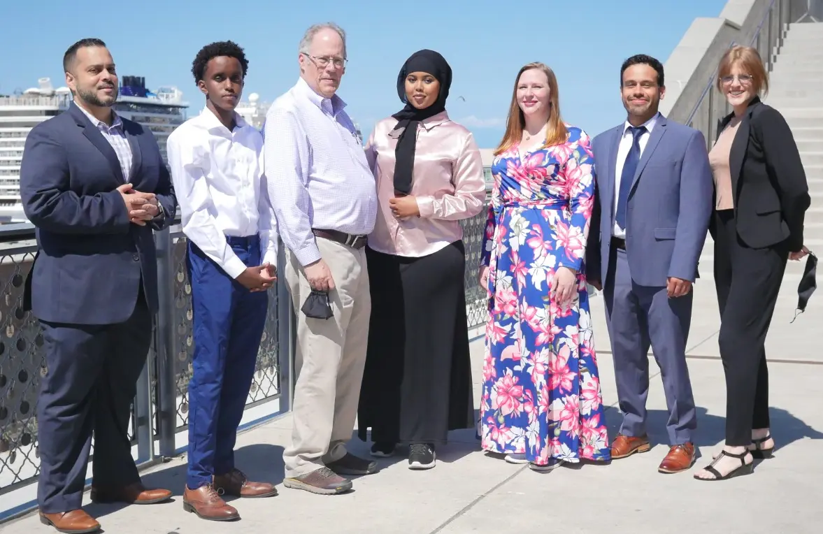 Brianna stands along the Seattle skyline with other team members of CAIR Washington.